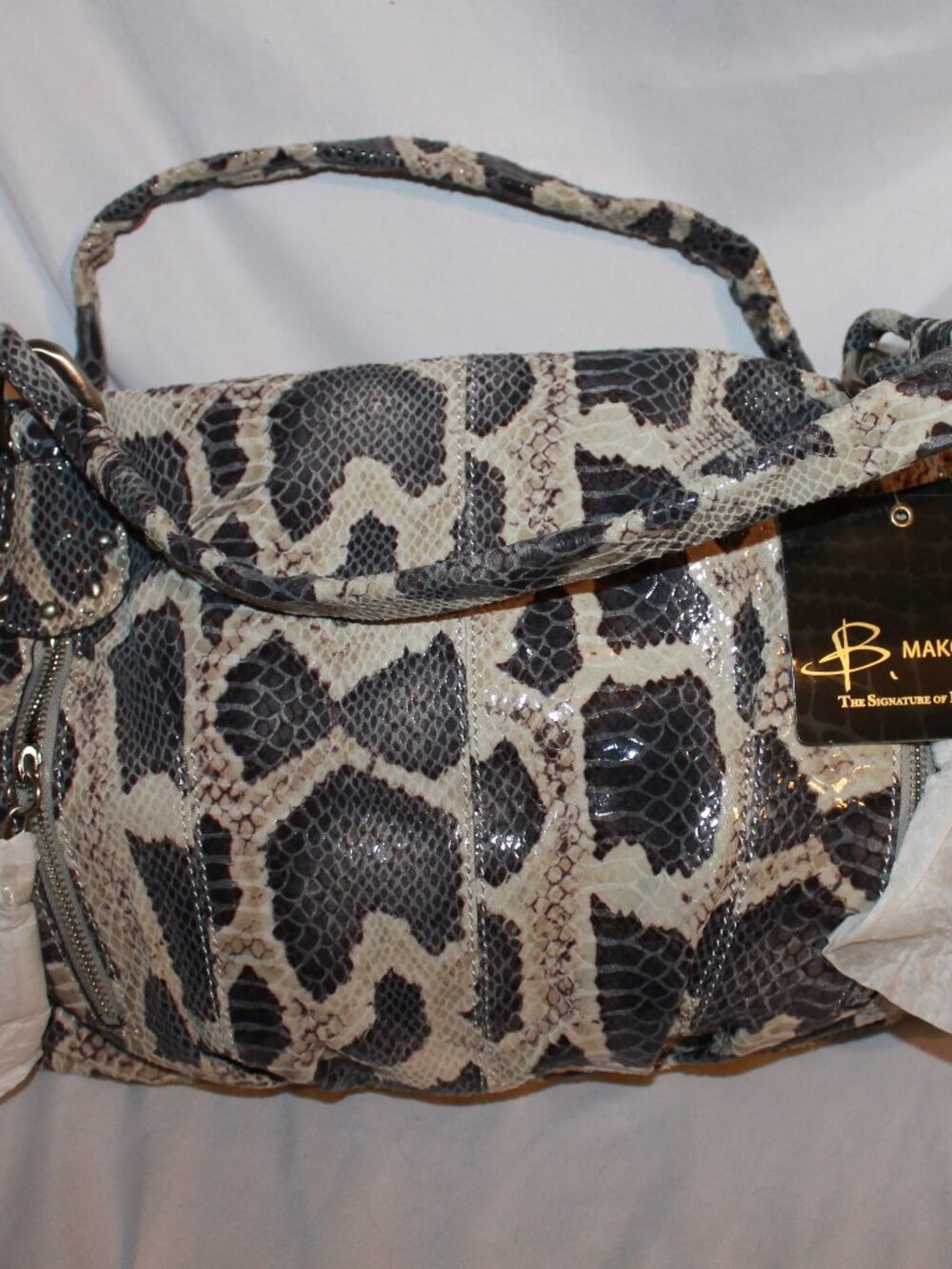 This is a B. Makowsky Python Snakeskin purse